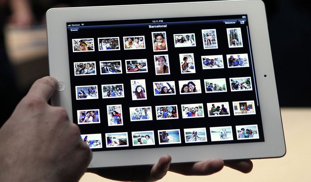 iPhoto chega ao iOS (Foto: Robert Galbraith/Reuters) iPhoto chega ao iOS