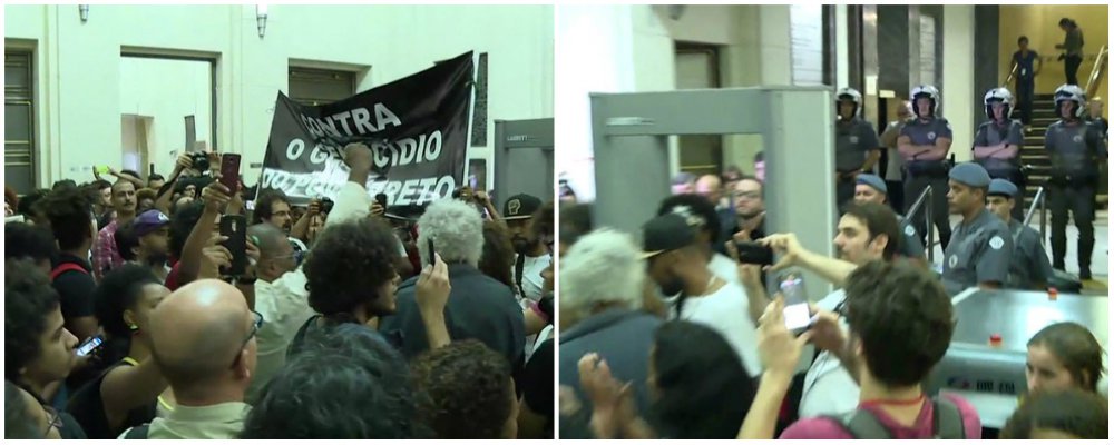 Em protesto pela morte de cinco jovens da zona leste da capital paulista que iam para uma festa em Ribeirão Pires, na Grande São Paulo, integrantes de movimentos sociais ocuparam, por volta das 19h40 desta quinta (10), o saguão da Secretaria de Segurança Pública de São Paulo; a intenção dos manifestantes é permanecer no local até que sejam recebidos pelo secretário Mágino Alves Barbosa Filho; acompanhado de policiais, o secretário desceu do gabinete, foi até o saguão onde estão os manifestantes e disse que iria negociar com uma comissão formada por quatro pessoas
(Foto: Valter Lima) Em protesto pela morte de cinco jovens da zona leste da capital paulista que iam para uma festa em Ribeirão Pires, na Grande São Paulo, integrantes de movimentos sociais ocuparam, por volta das 19h40 desta quinta (10), o saguão da Secretaria de Segurança Pública de São Paulo; a intenção dos manifestantes é permanecer no local até que sejam recebidos pelo secretário Mágino Alves Barbosa Filho; acompanhado de policiais, o secretário desceu do gabinete, foi até o saguão onde estão os manifestantes e disse que iria negociar com uma comissão formada por quatro pessoas
