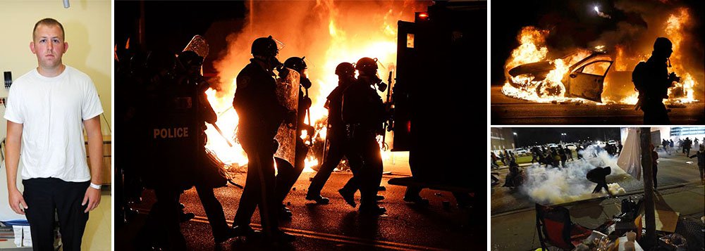 Ao menos 12 prédios foram incendiados em Ferguson, no Estado norte-americano do Missouri, em uma onda de protestos após um júri ter decidido não indiciar um policial branco que matou a tiros um adolescente negro desarmado em agosto, informou a polícia; Michael Brown, de 18 anos, morreu ao ser baleado pelo policial Darren Wilson, em 9 de agosto (Foto: Leonardo Attuch) Ao menos 12 prédios foram incendiados em Ferguson, no Estado norte-americano do Missouri, em uma onda de protestos após um júri ter decidido não indiciar um policial branco que matou a tiros um adolescente negro desarmado em agosto, informou a polícia; Michael Brown, de 18 anos, morreu ao ser baleado pelo policial Darren Wilson, em 9 de agosto