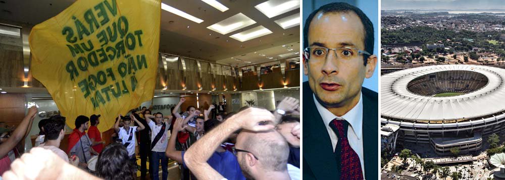Com bandeiras e tambores, integrantes do Comitê Popular da Copa, cujo slogan é O Maraca É Nosso, ocupam sede do grupo Odebrecht, de Marcelo Odebrecht, em Botafogo; pedido de desistência da administração do estádio por 35 anos é formalizado; "o Maracanã tem de voltar a ser o estádio público que sempre foi", diz Gustavo Mehl; empresa ainda pode formalizar saída (Foto: Sheila Lopes) Com bandeiras e tambores, integrantes do Comitê Popular da Copa, cujo slogan é O Maraca É Nosso, ocupam sede do grupo Odebrecht, de Marcelo Odebrecht, em Botafogo; pedido de desistência da administração do estádio por 35 anos é formalizado; "o Maracanã tem de voltar a ser o estádio público que sempre foi", diz Gustavo Mehl; empresa ainda pode formalizar saída