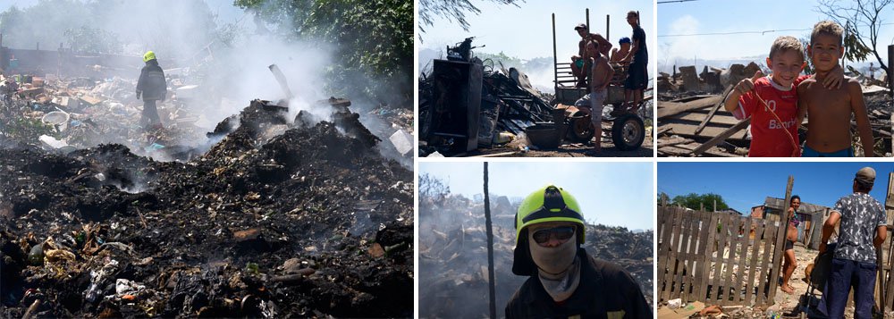 Fogo que começou no início da noite de segunda-feira devastou galpões de reciclagem e algumas pequenas casas do local; ninguém ficou ferido; quatro bombeiros passaram mal ao inalarem fumaça e tiveram de ser levados ao Hospital Cristo Redentor para atendimento (Foto: Roberta Namour) Fogo que começou no início da noite de segunda-feira devastou galpões de reciclagem e algumas pequenas casas do local; ninguém ficou ferido; quatro bombeiros passaram mal ao inalarem fumaça e tiveram de ser levados ao Hospital Cristo Redentor para atendimento