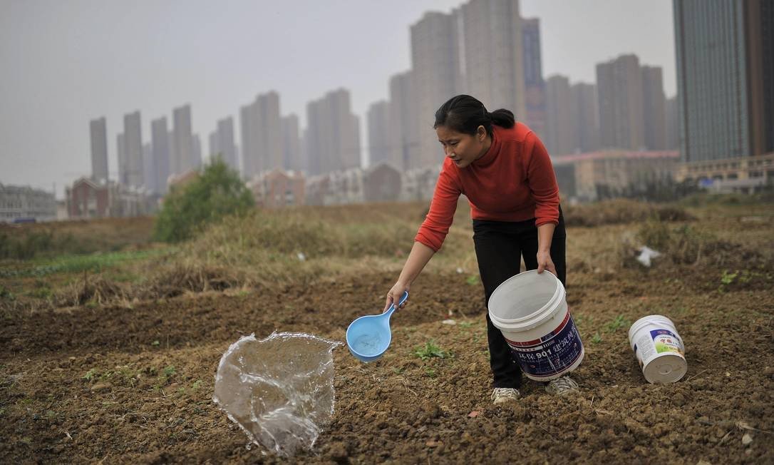 Lições chinesas sobre o direito à terra (Foto: Reuters) Lições chinesas sobre o direito à terra