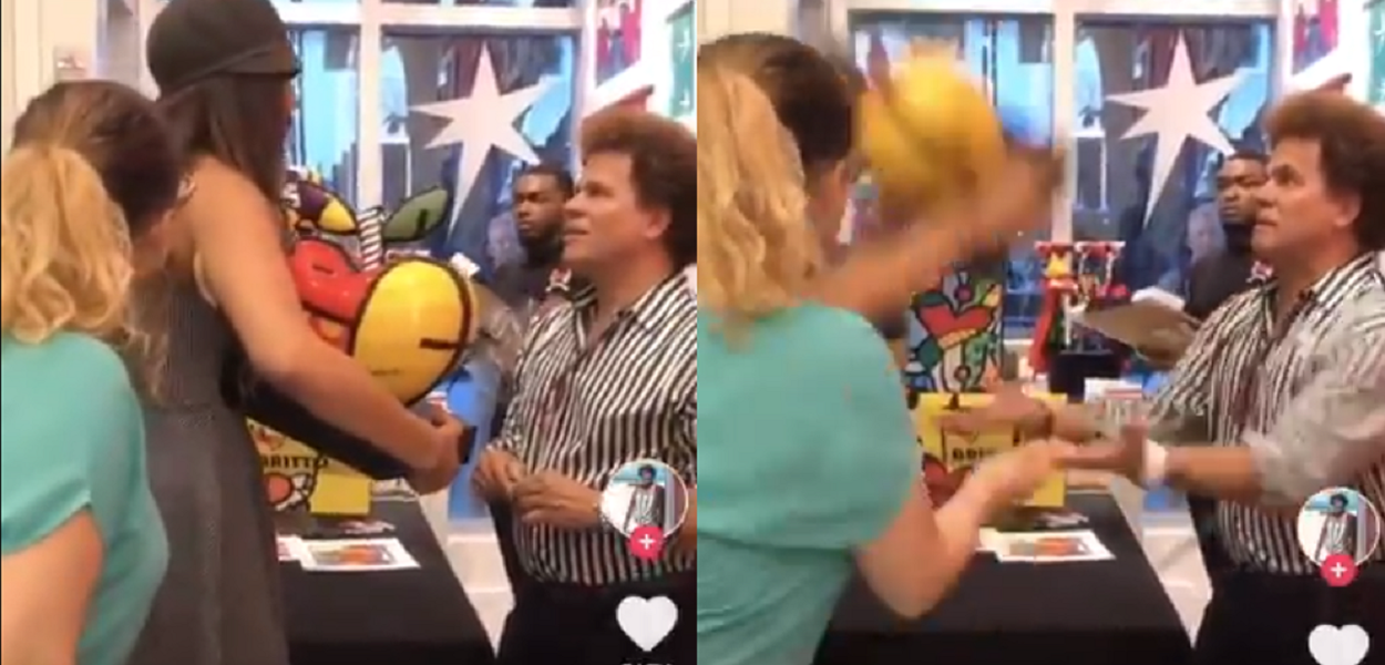 Mulher quebra obra de Romero Brito (Foto: Reprodução) Mulher quebra obra de Romero Brito