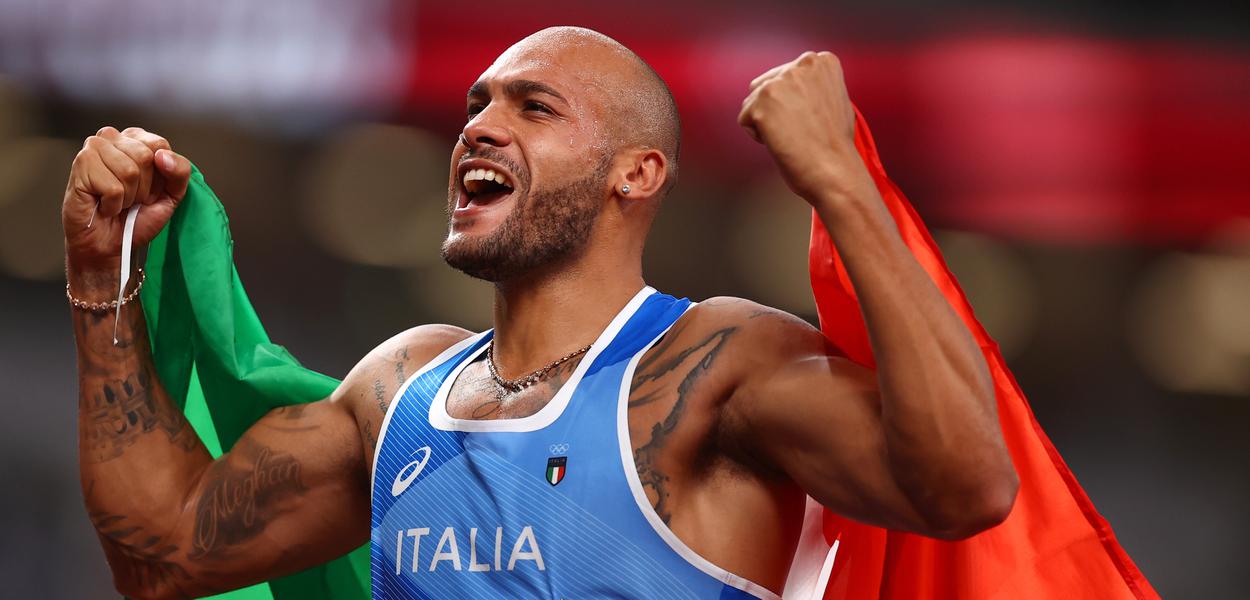 Marcell Jacobs comemora ouro nos 100m rasos
1/8/2021 REUTERS/Andrew Boyers (Foto: Andrew Boyers/Reuters) Marcell Jacobs comemora ouro nos 100m rasos
1/8/2021 REUTERS/Andrew Boyers