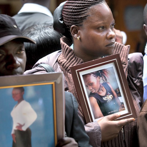 Cousin Teresa Apiyo (c) and an unidentified relative (l) hold photographs of student Selpha Aoko Wanda, 21, who was killed in last week's Garissa attack at the Chiromo Funeral Parlour in Nairobi, Kenya, on April 9. Cousin Teresa Apiyo (c) and an unidentified relative (l) hold photographs of student Selpha Aoko Wanda, 21, who was killed in last week's Garissa attack at the Chiromo Funeral Parlour in Nairobi, Kenya, on April 9.