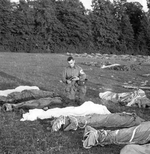 Father Francis Sampson, who was known as the 'Parachute Padre,' gives last rites to paratroopers killed in action during the D-Day invasion of Normandy. Father Francis Sampson, who was known as the 'Parachute Padre,' gives last rites to paratroopers killed in action during the D-Day invasion of Normandy.