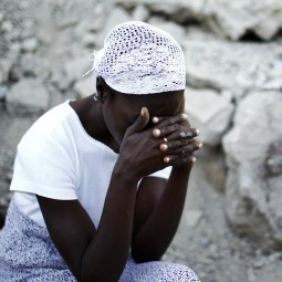HOW LONG, O LORD? A woman prays in front of the destroyed Cathedral of Our Lady of the Assumption in Port-au-Prince, Haiti, Jan. 12, as Haitians marked the first anniversary of the earthquake that flattened much of the capital. HOW LONG, O LORD? A woman prays in front of the destroyed Cathedral of Our Lady of the Assumption in Port-au-Prince, Haiti, Jan. 12, as Haitians marked the first anniversary of the earthquake that flattened much of the capital.