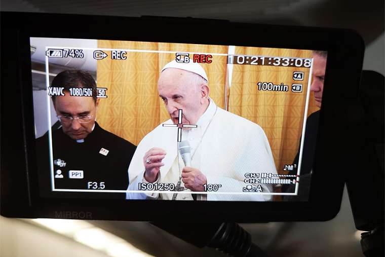Pope Francis on the return flight from his trip to Geneva, Switzerland, June 21. Pope Francis on the return flight from his trip to Geneva, Switzerland, June 21.