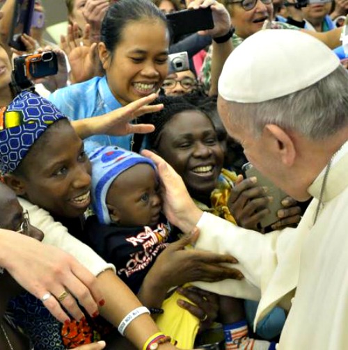 Pope Francis greets pilgrims before his general audience in the Paul VI Hall on Aug. 19. Pope Francis greets pilgrims before his general audience in the Paul VI Hall on Aug. 19.