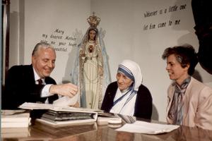 Jerry and Gwen Coniker converse with Mother Teresa, who was on the advisory council of their apostolate, Apostolate for Family Consecration. The very first show Coniker taped was an interview with Mother Teresa. AFC programs ran on EWTN and included Mother Angelica (shown at right, below, with Jerry, far left). Jerry and Gwen Coniker converse with Mother Teresa, who was on the advisory council of their apostolate, Apostolate for Family Consecration. The very first show Coniker taped was an interview with Mother Teresa. AFC programs ran on EWTN and included Mother Angelica (shown at right, below, with Jerry, far left).