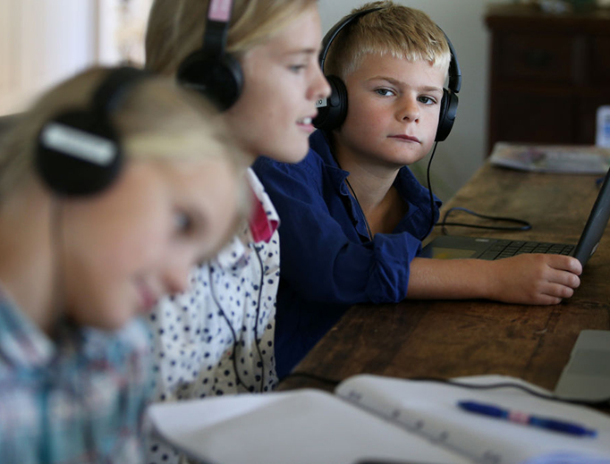 Alessia Bowman, 10, Sybella Bowman, 12, and Oliver Bowman, 8, do school work at their family home and cattle property on April 5, 2020, in Tarpoly Creek, Australia. Alessia Bowman, 10, Sybella Bowman, 12, and Oliver Bowman, 8, do school work at their family home and cattle property on April 5, 2020, in Tarpoly Creek, Australia.