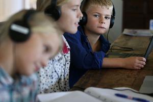 Alessia Bowman, 10, Sybella Bowman, 12, and Oliver Bowman, 8, do school work at their family home and cattle property on April 5, 2020, in Tarpoly Creek, Australia. Alessia Bowman, 10, Sybella Bowman, 12, and Oliver Bowman, 8, do school work at their family home and cattle property on April 5, 2020, in Tarpoly Creek, Australia.