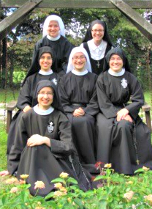 Pasionist Sisters from Whitesville Ky.; below, a Holy Spirit Adoration Sister prays in front of the tabernacle; and Benedictine Sister Jacinta Phipps (r) on the day of her profession. Pasionist Sisters from Whitesville Ky.; below, a Holy Spirit Adoration Sister prays in front of the tabernacle; and Benedictine Sister Jacinta Phipps (r) on the day of her profession.