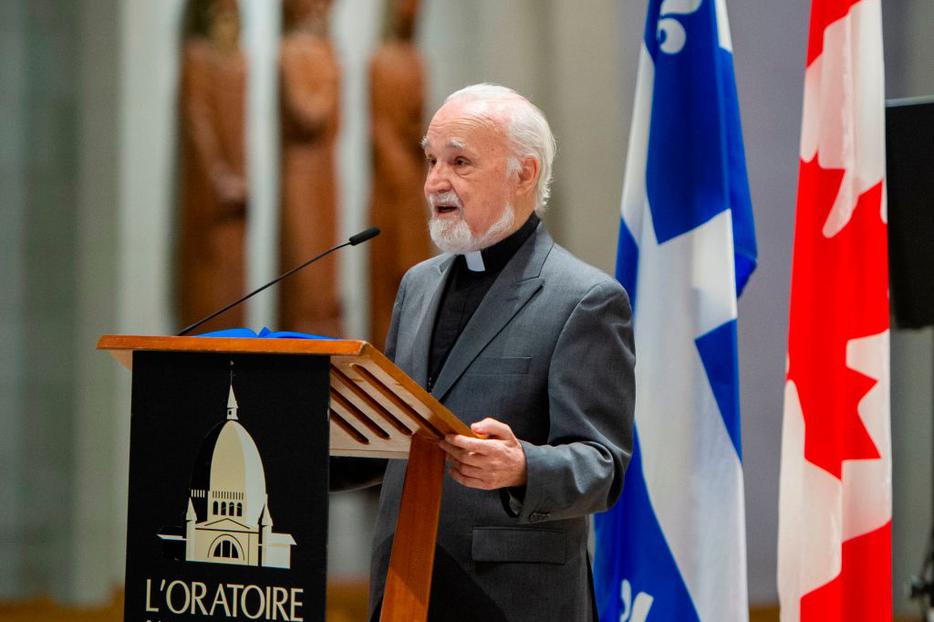 Father Claude Grou, shown speaking at a March 1 news conference about the work to be done at St. Joseph's Oratory in Montreal, was stabbed during a livestreamed morning Mass at the oratory. He has been released from the hospital. Father Claude Grou, shown speaking at a March 1 news conference about the work to be done at St. Joseph's Oratory in Montreal, was stabbed during a livestreamed morning Mass at the oratory. He has been released from the hospital.