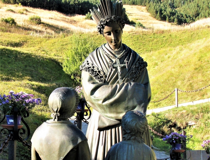 Mary appeared in the French Alps in 1846, requesting conversion ahead of famine, as commemorated in statues; pilgrims find solace in the basilica in the hills. Mary appeared in the French Alps in 1846, requesting conversion ahead of famine, as commemorated in statues; pilgrims find solace in the basilica in the hills.
