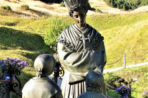 Mary appeared in the French Alps in 1846, requesting conversion ahead of famine, as commemorated in statues; pilgrims find solace in the basilica in the hills. Mary appeared in the French Alps in 1846, requesting conversion ahead of famine, as commemorated in statues; pilgrims find solace in the basilica in the hills.