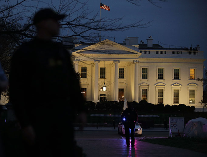 Members of the U.S. Secret Service stand guard outside the White House on March 6, 2017. Activists staged a protest against President Donald Trump's second Executive Order banning travel from certain Muslim-majority countries. Members of the U.S. Secret Service stand guard outside the White House on March 6, 2017. Activists staged a protest against President Donald Trump's second Executive Order banning travel from certain Muslim-majority countries.