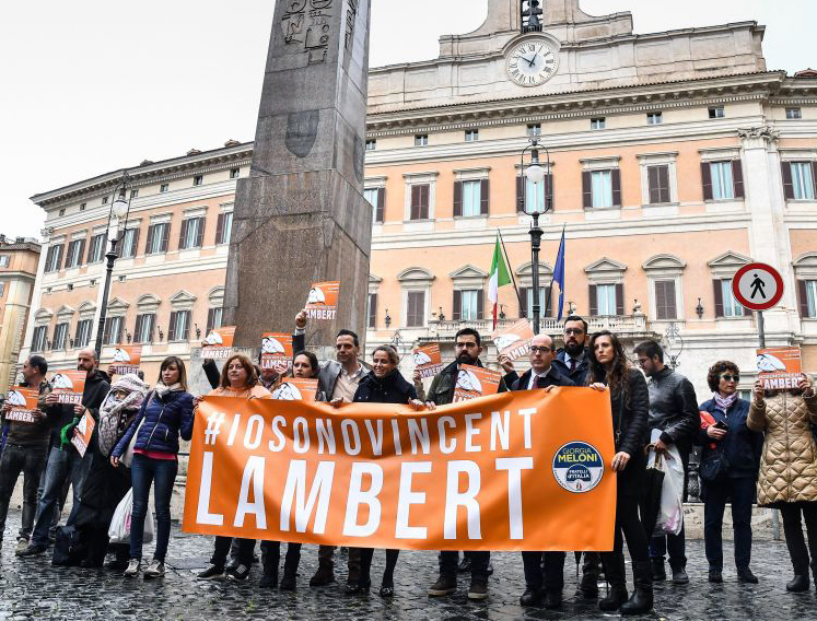 Italian members of the support committee of French quadriplegic Vincent Lambert, hold a banner reading "#I'm Vincent Lambert" as they protest in front of Montecitorio, the Italian Parliament, in central Rome, on May 20, 2019. Italian members of the support committee of French quadriplegic Vincent Lambert, hold a banner reading "#I'm Vincent Lambert" as they protest in front of Montecitorio, the Italian Parliament, in central Rome, on May 20, 2019.