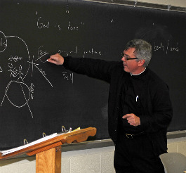 TEACHING THE TRUTH. In light of the firing and rehiring of Kenneth Howell from the University of Illinois at Urbana-Champaign, Msgr. Stuart Swetland (shown teaching at Mount St. Mary’s University), who hired Howell as the John Henry Newman Scholar in Residence when he was director of the St. John’s Catholic Newman Center at the university, speaks about the challenges to presenting Church teaching. TEACHING THE TRUTH. In light of the firing and rehiring of Kenneth Howell from the University of Illinois at Urbana-Champaign, Msgr. Stuart Swetland (shown teaching at Mount St. Mary’s University), who hired Howell as the John Henry Newman Scholar in Residence when he was director of the St. John’s Catholic Newman Center at the university, speaks about the challenges to presenting Church teaching.