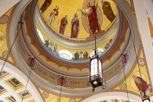 Above, the cathedral dome rises 144 feet into the air. Inside it are murals of the Sacred Heart flanked by Mary and St. Joseph, along with several other saints, ancient and modern. Below, the dedication Mass is underway. Above, the cathedral dome rises 144 feet into the air. Inside it are murals of the Sacred Heart flanked by Mary and St. Joseph, along with several other saints, ancient and modern. Below, the dedication Mass is underway.