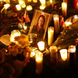 VIGIL. A picture of U.S. Rep. Gabrielle Giffords, D-Ariz., is surrounded by candles during a vigil outside the Tucson University Medical Center in Arizona Jan. 9. Giffords was in critical condition at the medical center after being shot in the head by Jared Lee Loughner, 22. He is accused of killing six people and wounding 14 others in the Jan. 8 shooting rampage. VIGIL. A picture of U.S. Rep. Gabrielle Giffords, D-Ariz., is surrounded by candles during a vigil outside the Tucson University Medical Center in Arizona Jan. 9. Giffords was in critical condition at the medical center after being shot in the head by Jared Lee Loughner, 22. He is accused of killing six people and wounding 14 others in the Jan. 8 shooting rampage.