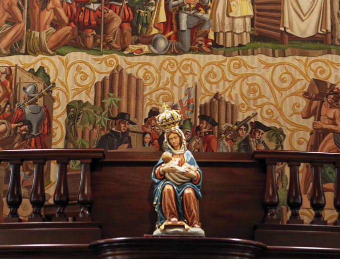 The sanctuary of the oldest church in Florida welcomes pilgrims to prayer and beckons reflection before a statue of the Blessed Mother. The sanctuary of the oldest church in Florida welcomes pilgrims to prayer and beckons reflection before a statue of the Blessed Mother.