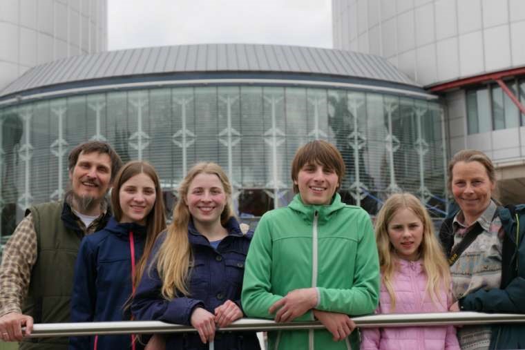 Dirk and Petra Wunderlich are pictured with their four children. Dirk and Petra Wunderlich are pictured with their four children.