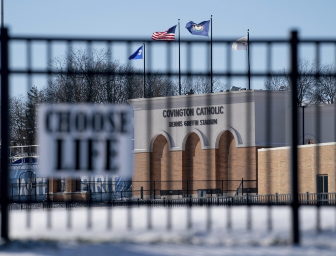 Flags fly over the Covington Catholic High School stadium in Park Kills, Kentucky, as a pro-life sign hangs on a fence, Jan. 20. Flags fly over the Covington Catholic High School stadium in Park Kills, Kentucky, as a pro-life sign hangs on a fence, Jan. 20.