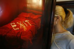 Anca, a former Romanian sex slave, hides her face behind a poster in Bucharest in this Dec. 1, 2006 file picture. Every year, thousands of women like Anca, some as young as 13, are kidnapped or lured by promises of well paying jobs or marriage and sold to gangs who lock them up in night clubs and brothels or force them to work on the streets. Anca, a former Romanian sex slave, hides her face behind a poster in Bucharest in this Dec. 1, 2006 file picture. Every year, thousands of women like Anca, some as young as 13, are kidnapped or lured by promises of well paying jobs or marriage and sold to gangs who lock them up in night clubs and brothels or force them to work on the streets.