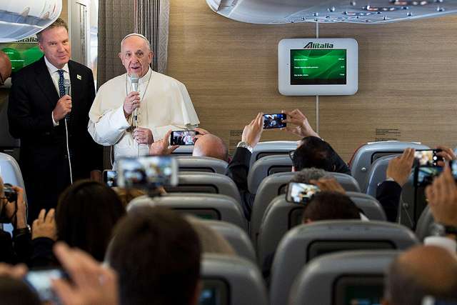 Pope Francis speaks to journalists aboard the flight from Rome to Bogota Sept. 6. Pope Francis speaks to journalists aboard the flight from Rome to Bogota Sept. 6.