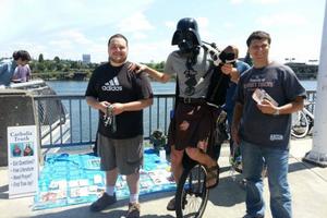 Steve Dawson (r) chats with ‘Darth Vader.’ Below, he further shares the Gospel, as does Archbishop Allen Vigneron. Steve Dawson (r) chats with ‘Darth Vader.’ Below, he further shares the Gospel, as does Archbishop Allen Vigneron.