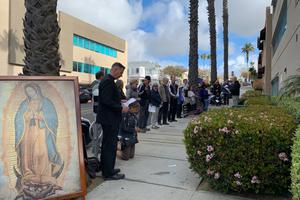Above, Bishop Joseph Coffey prays the Rosary in front of a Planned Parenthood center in San Diego. Above, Bishop Joseph Coffey prays the Rosary in front of a Planned Parenthood center in San Diego.