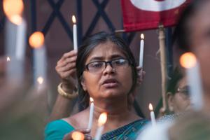 People hold candles during a rally to protest the sexual assault of a 70 year old nun in Kolkata, India on March 18, 2015. People hold candles during a rally to protest the sexual assault of a 70 year old nun in Kolkata, India on March 18, 2015.