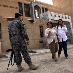 ENDANGERED SPECIES? An Iraqi police officer stands guard outside of St. Joseph Chaldean Church in Baghdad following a Sunday liturgy on July 24. Forming one of the oldest Christian communities of the Middle East, Iraqi Christians have been targeted for attack since 2003, with numerous abductions, murders and threats for them to leave Iraq. In 1980 Iraqi Christians made up over 7% of the population and have now declined to below 3%. St. Joseph, which was established in 1959 and which once had as many as 1,200 families in its parish, now has only 150 to 200 families left. ENDANGERED SPECIES? An Iraqi police officer stands guard outside of St. Joseph Chaldean Church in Baghdad following a Sunday liturgy on July 24. Forming one of the oldest Christian communities of the Middle East, Iraqi Christians have been targeted for attack since 2003, with numerous abductions, murders and threats for them to leave Iraq. In 1980 Iraqi Christians made up over 7% of the population and have now declined to below 3%. St. Joseph, which was established in 1959 and which once had as many as 1,200 families in its parish, now has only 150 to 200 families left.