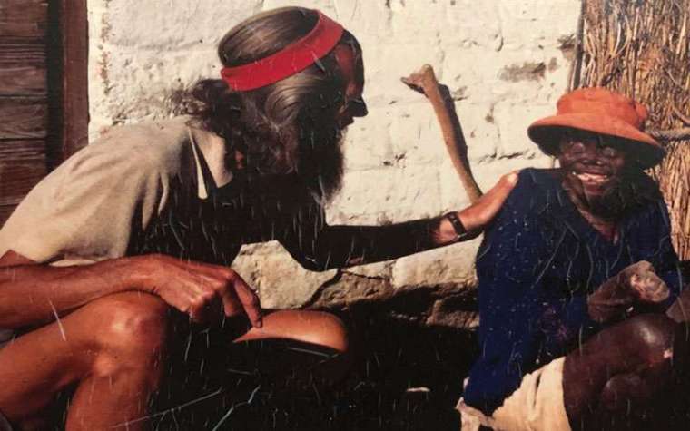 An undated photo shows John Bradburne (l) speaking with a leper. An undated photo shows John Bradburne (l) speaking with a leper.