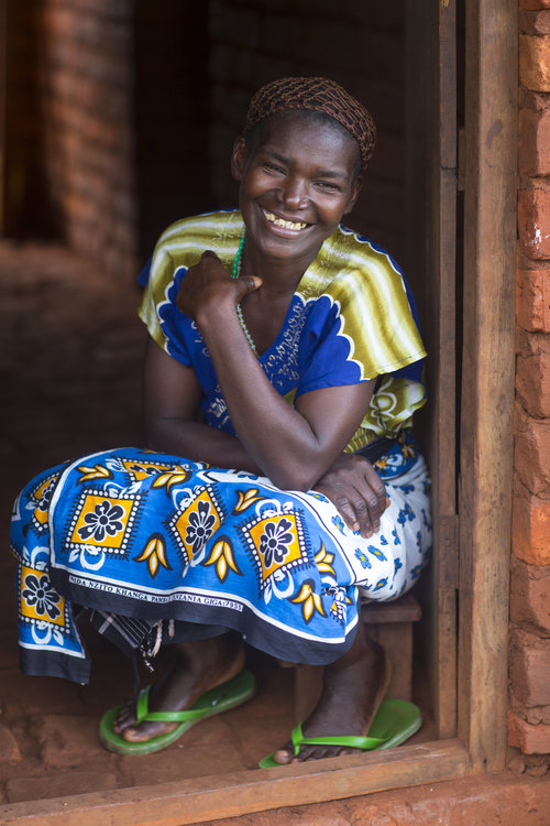 Gertruda (above) and her granddaughter harvest soybeans in their fields in Nakahegwa, Tanzania. Since joining the CRS project in her village, Gertruda has doubled her soybean harvest and has increased her earnings sixfold. Gertruda (above) and her granddaughter harvest soybeans in their fields in Nakahegwa, Tanzania. Since joining the CRS project in her village, Gertruda has doubled her soybean harvest and has increased her earnings sixfold.