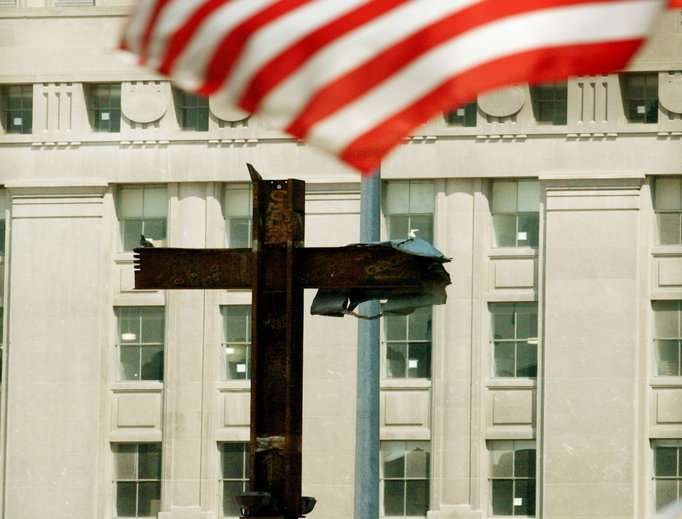 An American flag flies above the cross of steel beams discovered in the rubble at Ground Zero on Aug. 19, 2002, in New York City. An American flag flies above the cross of steel beams discovered in the rubble at Ground Zero on Aug. 19, 2002, in New York City.