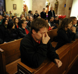 Mourners gather inside the St. Rose of Lima Roman Catholic Church at a vigil service for victims of the Sandy Hook School shooting Dec. 14 in Newtown, Conn. Mourners gather inside the St. Rose of Lima Roman Catholic Church at a vigil service for victims of the Sandy Hook School shooting Dec. 14 in Newtown, Conn.