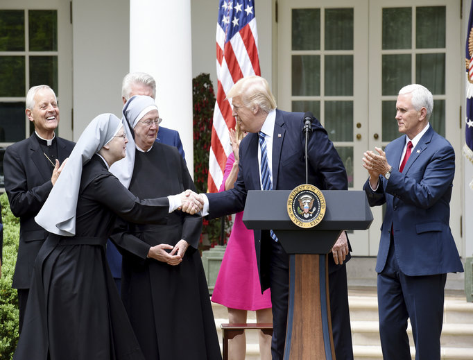 President Donald Trump greets on stage the Little Sisters of the Poor, flanked by Cardinal Donald Wuerl of Washington and Vice President Mike Pence, before signing the executive order on promoting free speech and religious liberty during a National Day of Prayer event in the Rose Garden of the White House in Washington, D.C., May 4.
President Donald Trump greets on stage the Little Sisters of the Poor, flanked by Cardinal Donald Wuerl of Washington and Vice President Mike Pence, before signing the executive order on promoting free speech and religious liberty during a National Day of Prayer event in the Rose Garden of the White House in Washington, D.C., May 4.