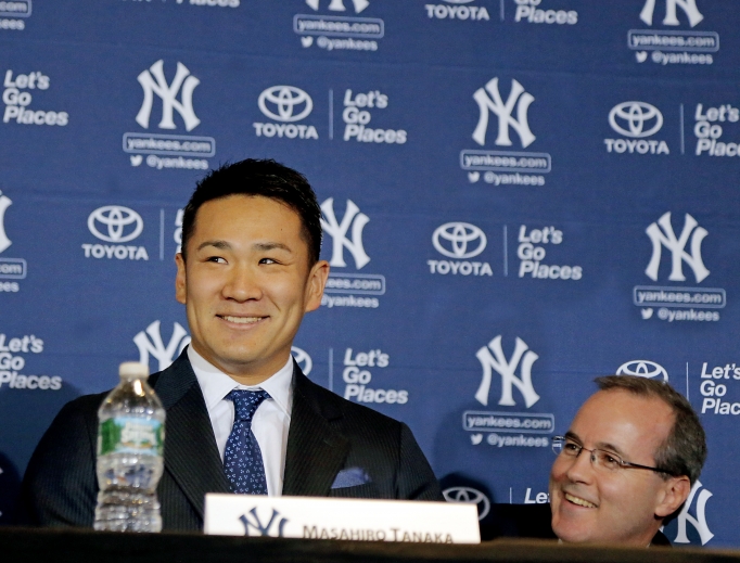 Above, George Rose (r) during pitcher Masahiro Tanaka’s introductory news conference with the Yankees in 2014. Below, Rose (c) with his son, Sean, and wife, Carrie, in front of the sarcophagus of Blessed Father Michael Sopocko, above which hangs his portrait. This was taken in April of this year during a pilgrimage to the Divine Mercy Sanctuary in Bialystok, Poland. The Roses are seeking the blessed's intercession for George's cancer. Above, George Rose (r) during pitcher Masahiro Tanaka’s introductory news conference with the Yankees in 2014. Below, Rose (c) with his son, Sean, and wife, Carrie, in front of the sarcophagus of Blessed Father Michael Sopocko, above which hangs his portrait. This was taken in April of this year during a pilgrimage to the Divine Mercy Sanctuary in Bialystok, Poland. The Roses are seeking the blessed's intercession for George's cancer.