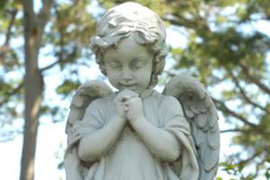 Praying angel child statue at Our Lady of La Leche in St. Augustine, Florida. Praying angel child statue at Our Lady of La Leche in St. Augustine, Florida.