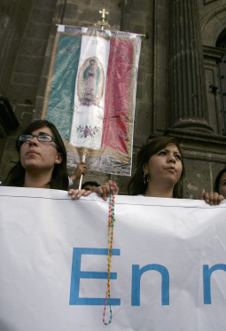 People supporting Cardinal Juan Sandoval Iniguez of Guadalajara, Mexico, pray outside the cathedral in Guadalajara Aug. 22. The Mexican Supreme Court recently upheld the legality of same-sex couples adopting children and rebuked Cardinal Sandoval, who accused the 11 judges of being bribed by the mayor of Mexico City and international organizations. People supporting Cardinal Juan Sandoval Iniguez of Guadalajara, Mexico, pray outside the cathedral in Guadalajara Aug. 22. The Mexican Supreme Court recently upheld the legality of same-sex couples adopting children and rebuked Cardinal Sandoval, who accused the 11 judges of being bribed by the mayor of Mexico City and international organizations.