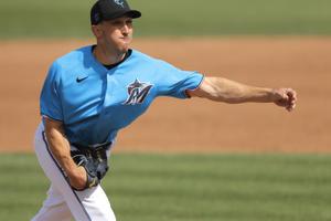 Miami Marlins switch-pitcher Pat Venditte throws left-handed to the Washington Nationals during the eighth inning of a spring training baseball game March 10, in Jupiter, Fla., before the season was put on hold due to COVID-19. Miami Marlins switch-pitcher Pat Venditte throws left-handed to the Washington Nationals during the eighth inning of a spring training baseball game March 10, in Jupiter, Fla., before the season was put on hold due to COVID-19.