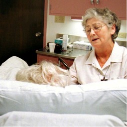 Franciscan Sister Camillus McGoldrick talks to a patient in the emergency room at St. Francis Hospital in Wilmington, Del., in this file photo. Franciscan Sister Camillus McGoldrick talks to a patient in the emergency room at St. Francis Hospital in Wilmington, Del., in this file photo.