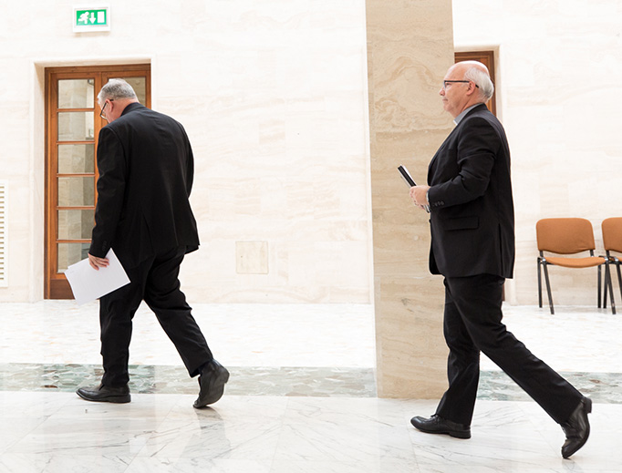 Bishop Fernando Ramos, auxiliary bishop of Santiago, and Bishop Juan Ignacio González of San Bernardo, a member of Chile's national commission for the protection of minors, leave a press conference on May 18, 2018, announcing the resignation of all 34 Chilean bishops at the close of their 3-day meeting with Pope Francis in Vatican City.
Bishop Fernando Ramos, auxiliary bishop of Santiago, and Bishop Juan Ignacio González of San Bernardo, a member of Chile's national commission for the protection of minors, leave a press conference on May 18, 2018, announcing the resignation of all 34 Chilean bishops at the close of their 3-day meeting with Pope Francis in Vatican City.