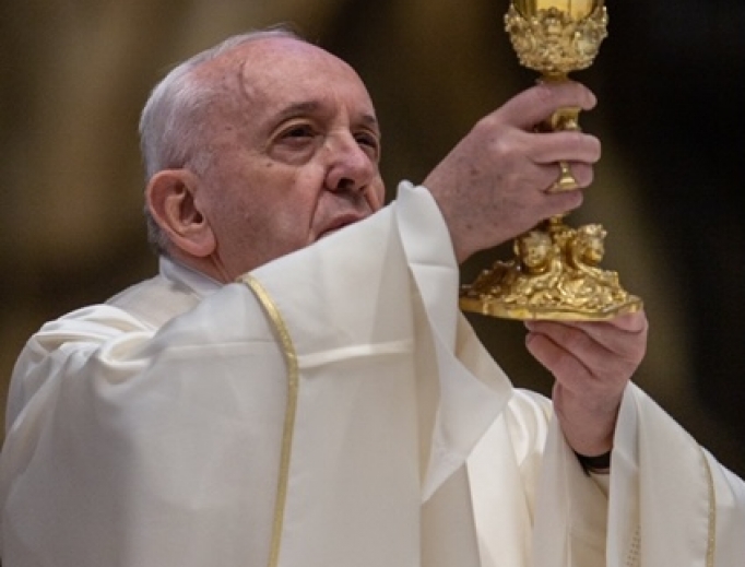 Pope Francis lifts the chalice during Mass on April 9, 2020. Pope Francis lifts the chalice during Mass on April 9, 2020.