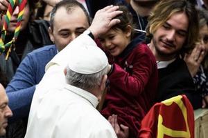 Pope Francis greets a small child during his General Audience, February 12, 2020. Pope Francis greets a small child during his General Audience, February 12, 2020.