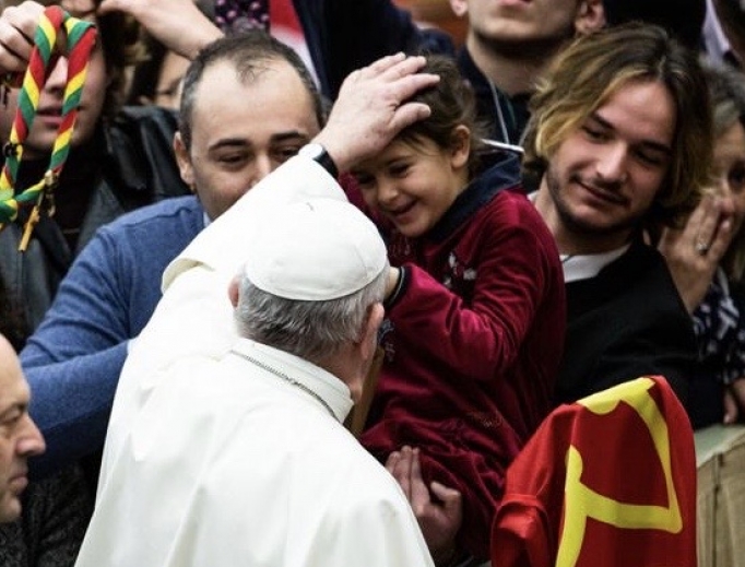 Pope Francis greets a small child during his General Audience, February 12, 2020. Pope Francis greets a small child during his General Audience, February 12, 2020.