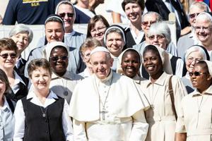 Pope Francis smiles with sisters at his general audience Sept. 11. Pope Francis smiles with sisters at his general audience Sept. 11.