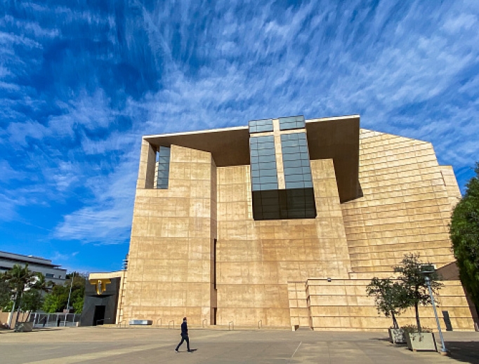 A man walks outside of the Cathedral of Our Lady of the Angels with the church doors closed to the public while Archbishop José Gomez leads a Sunday Mass, streamed online, March 22 in Los Angeles. A man walks outside of the Cathedral of Our Lady of the Angels with the church doors closed to the public while Archbishop José Gomez leads a Sunday Mass, streamed online, March 22 in Los Angeles.